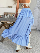  Back walking view of Lyvérielle Cascade Skirt light blue with cascading ruffled hem movement