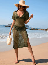 Model wearing matcha green slit openwork Johnny collar short sleeve cover-up dress styled with a straw hat at beachside