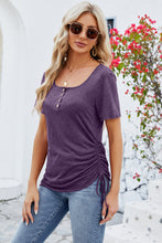 Model wearing a mauve ruched square neck T-shirt, side angle highlighting the ruching and soft stretch fabric.
