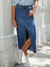 Medium Denvara Denim Midi Skirt styled with blue button-down shirt and white sneakers for a casual look