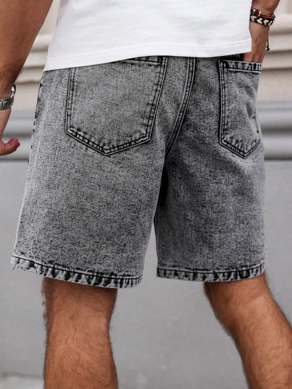 Men's embroidered distressed dark gray denim shorts back view on model.