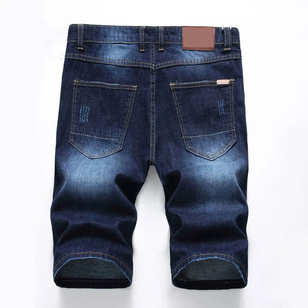 Back view showing rear pockets and slim fit of men's dark blue denim shorts.