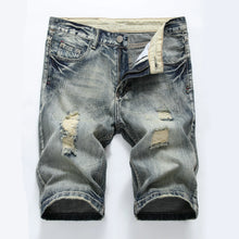 Front view of men's grey slim fit light washed distressed denim shorts.