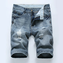 Front view of men's vintage blue slim fit light washed distressed denim shorts.