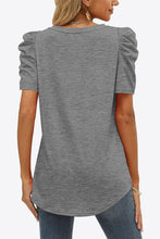 Back view of mid gray puff sleeve V-neck tee with smooth finish and puffed short sleeves visible from the rear angle.