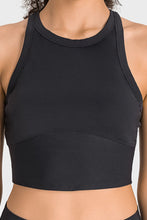 Woman wearing black Millennia Aero Racerback Tank, front view