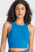 Woman wearing blue Millennia Aero Racerback Tank, front view