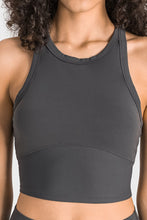 Close-up of gray Aero Racerback Tank paired with a cross-body bag