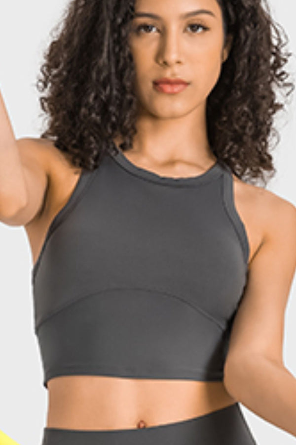 Woman wearing gray Millennia Aero Racerback Tank, front view.