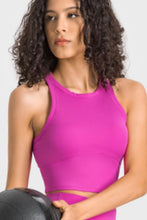 Woman wearing Magenta Millennia Aero Racerback Tank, front view
