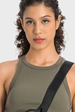 Close-up of sage Aero Racerback Tank paired with a cross-body bag