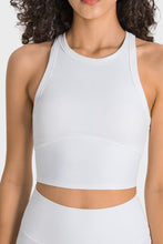 Woman wearing white Millennia Aero Racerback Tank, front view