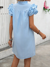 Model zoomed-in back view of Pastel Blue Ruffled Notched Dress.