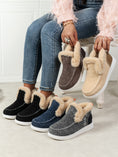 Model wearing a black pair of Furry Suede Round Toe Flat Sneakers while showcasing the navy, chocolate, beige, and grey Furry Suede Round Toe Flat Sneakers