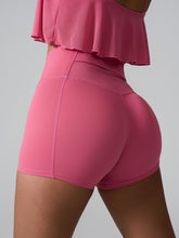 Momentum FlexTone Pocket Shorts back view in deep pink with mid-back pocket.