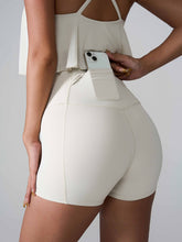 Momentum FlexTone Pocket Shorts back view in white with mid-back pocket.