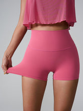Momentum FlexTone Pocket Shorts front view in deep pink high-waist design.