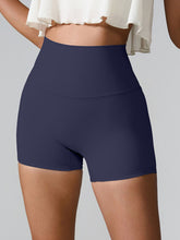 Momentum FlexTone Pocket Shorts front view in navy high-waist design.