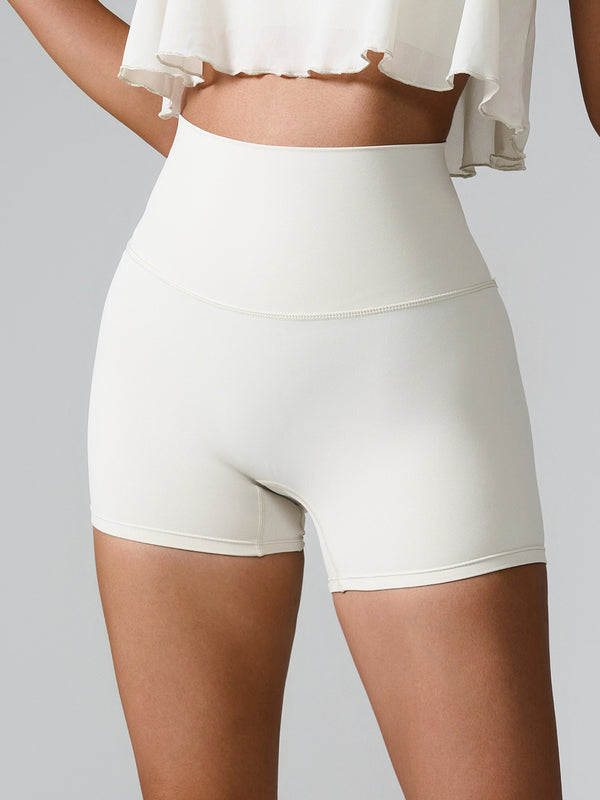 Momentum FlexTone Pocket Shorts front view in white high-waist design.