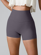 Model wearing Momentum FlexTone Pocket Shorts in charcoal styled for active day.