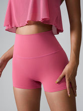 Model wearing Momentum FlexTone Pocket Shorts in deep pink styled for active day.