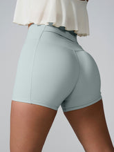 Momentum FlexTone Pocket Shorts side view in light blue showing sleek fit.