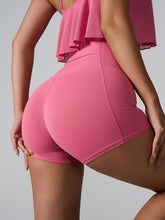 Motion twirl shot of Momentum FlexTone Pocket Shorts in deep pink highlighting fit.