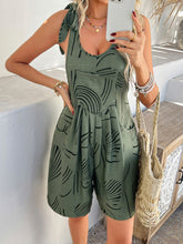 Kélure Moss overalls styled for an outdoor music festival look with layered jewelry and brim hat.