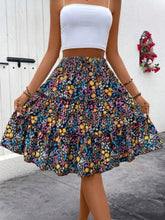 Multi Turquoise Florévyn Midi Skirt with floral print, frill tiers, and ruffled hem styled with white tube top