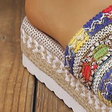 A close up of the multicolor Open Toe Platform Sandals highlighting woven design on platform sole.