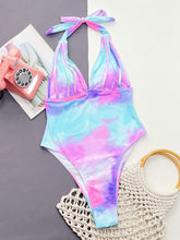 Multicolor tie-dye halter neck one-piece swimsuit front flat lay view