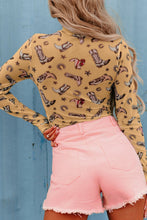 Back view of model dressed in a mustard Printed Mock Neck Long Sleeve Bodysuit with bold abstract print, paired with high-rise trousers.