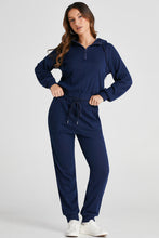 full body pose navy Navaro Duo showing drawstring hood half zip ribbed texture drawstring waist