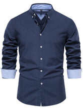 Front view of men’s navy Apex Flourish quarter-sleeve button-down shirt