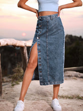 Navy Denivéra Button Skirt styled with light blue tee and sneakers on nature trail close-up