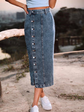 Navy Denivéra Button Skirt styled with tee and sneakers on nature trail close-up