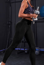 right side zoomed in view of nexaflex core leggings black lifting weights at gym