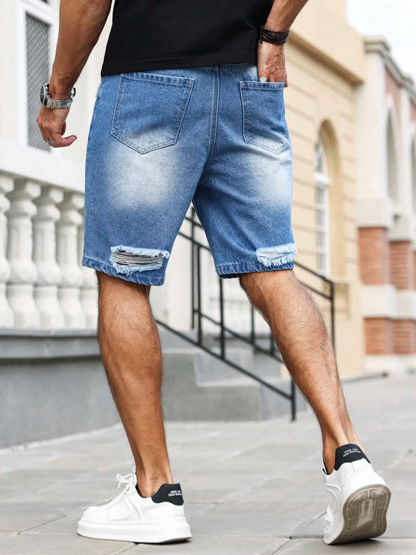 Men's blue ripped text logo printed denim shorts back view on model.