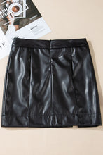 Close-up back flat lay of Nyvessia black PU leather mini skirt highlighting zip closure and seam details