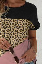 Close-up of leopard print detail on NyxSavra™ short sleeve tee.