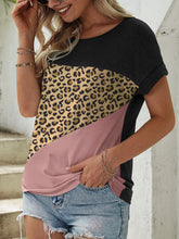 Model wearing NyxSavra™ tee paired with distressed jeans.