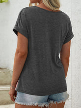 Back view of women's leopard contrast T-shirt with round neck in charcoal.