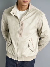 Off-White Men’s Luxe Suede Stand Collar Jacket front angle model pose featuring ribbed sleeve and zipped side pocket detail.