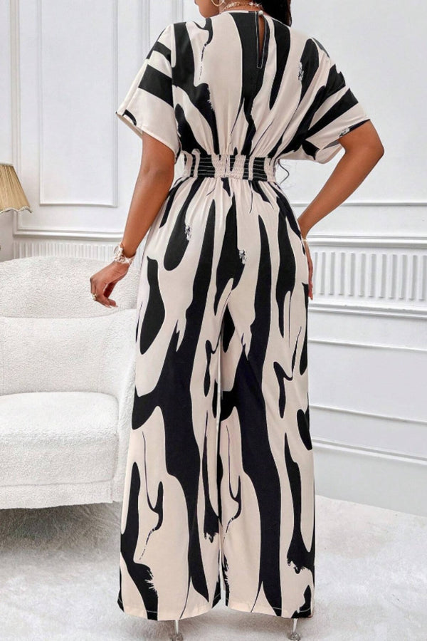 Close-up of the back neck button detail and wide-leg flow in black.
