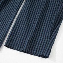  Flatlay of bottom hem with neat stitching and fabric texture.