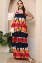 Model wearing the Ombravelle Tie-Dye Dress in multicolor at a beachside brunch, paired with sandals and gold hoops for a chic boho escape look.