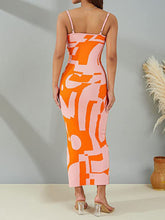 Back view of the Orange Luxnometry Maxi Sweater Dress highlighting its two-color angular patterns in a lavish mansion setting.