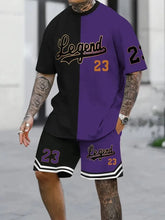 Man wearing a oversized deep purple Orrik 3D Printed Motion Set with 'Legend 23' text on contrast black & deep purple round neck tee and black & deep purple shorts with 'Legend 23' on them. 
