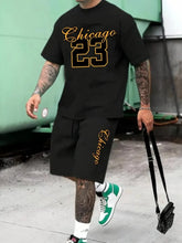 Model wearing a oversized obsidian Orrik 3D Printed Motion Set with 'Chicago 23' text on obsidian round neck tee and obsidian shorts with 'Chicago' on them.