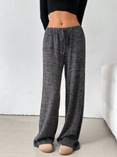 Female model showcasing Dark Grey Orvella LumaTide Striped Wide Leg Pants outfit idea for casual brunch or weekend outings.